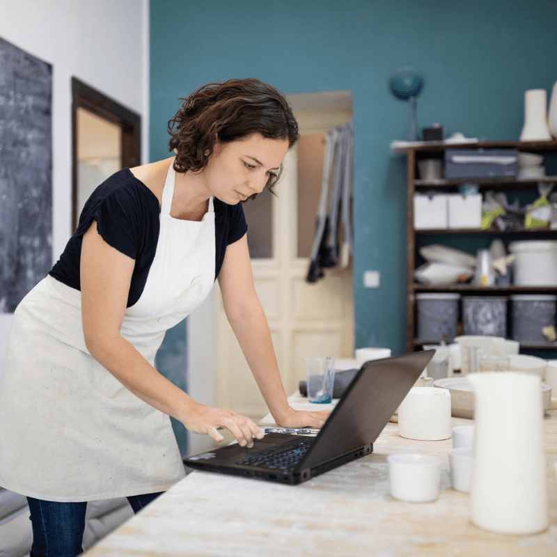 Young woman taking a stock inventroy at her place of work